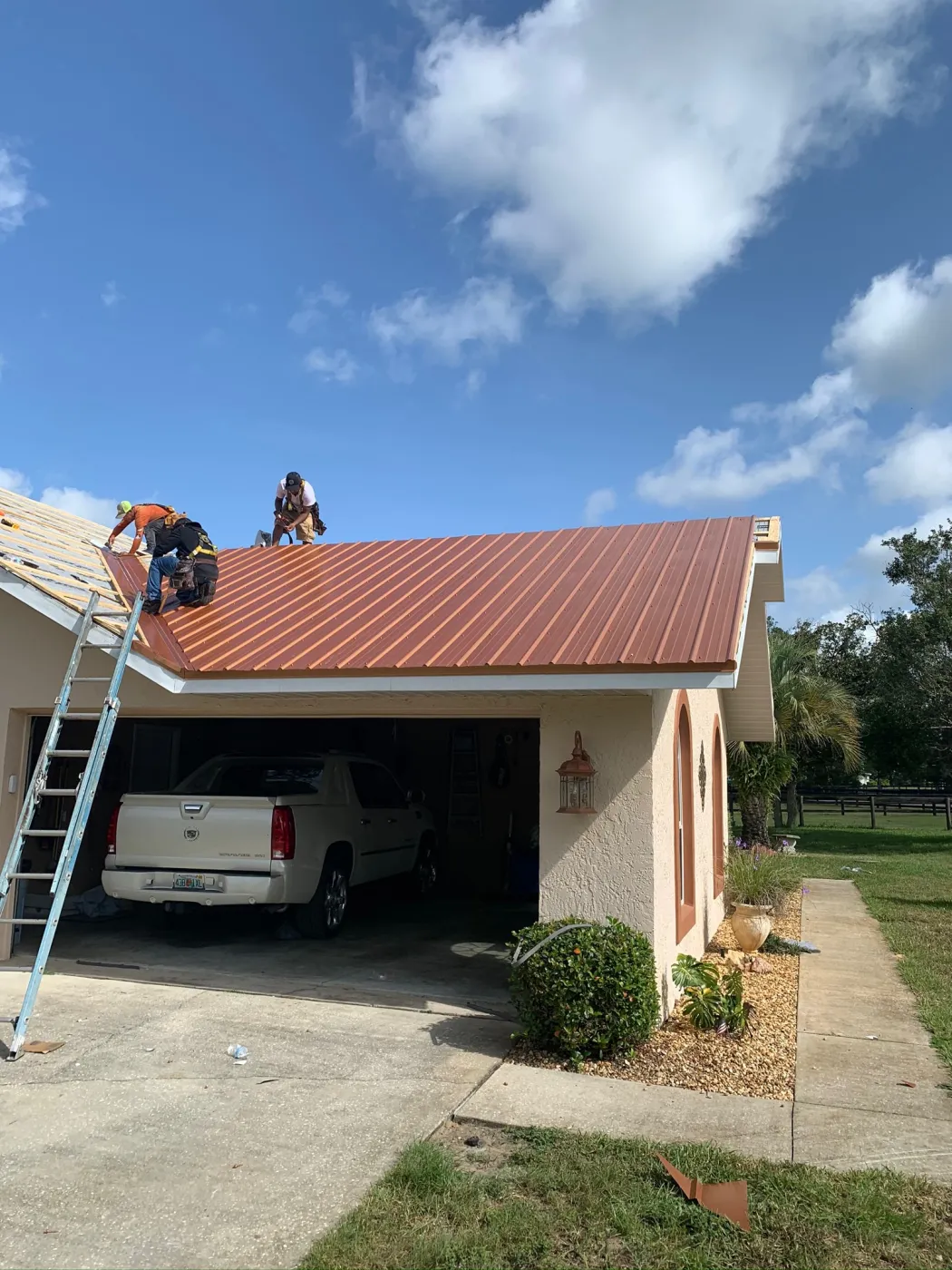 26-Gauge Copper Metal Roof Installation | Sentinel Roofing Alachua, FL Painted copper 26-gauge rib panel metal roof with exposed fasteners, purlins, and valley metal installed by Sentinel Roofing in Alachua, FL