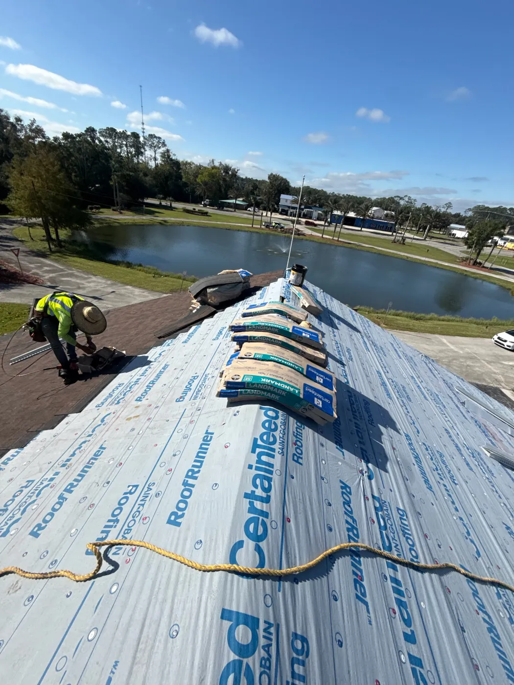 CertainTeed Landmark Commercial Roof Installation | Sentinel Roofing Alachua, FL CertainTeed Landmark shingle installation on a commercial building with roofing crew safety harnesses by Sentinel Roofing in Alachua, FL