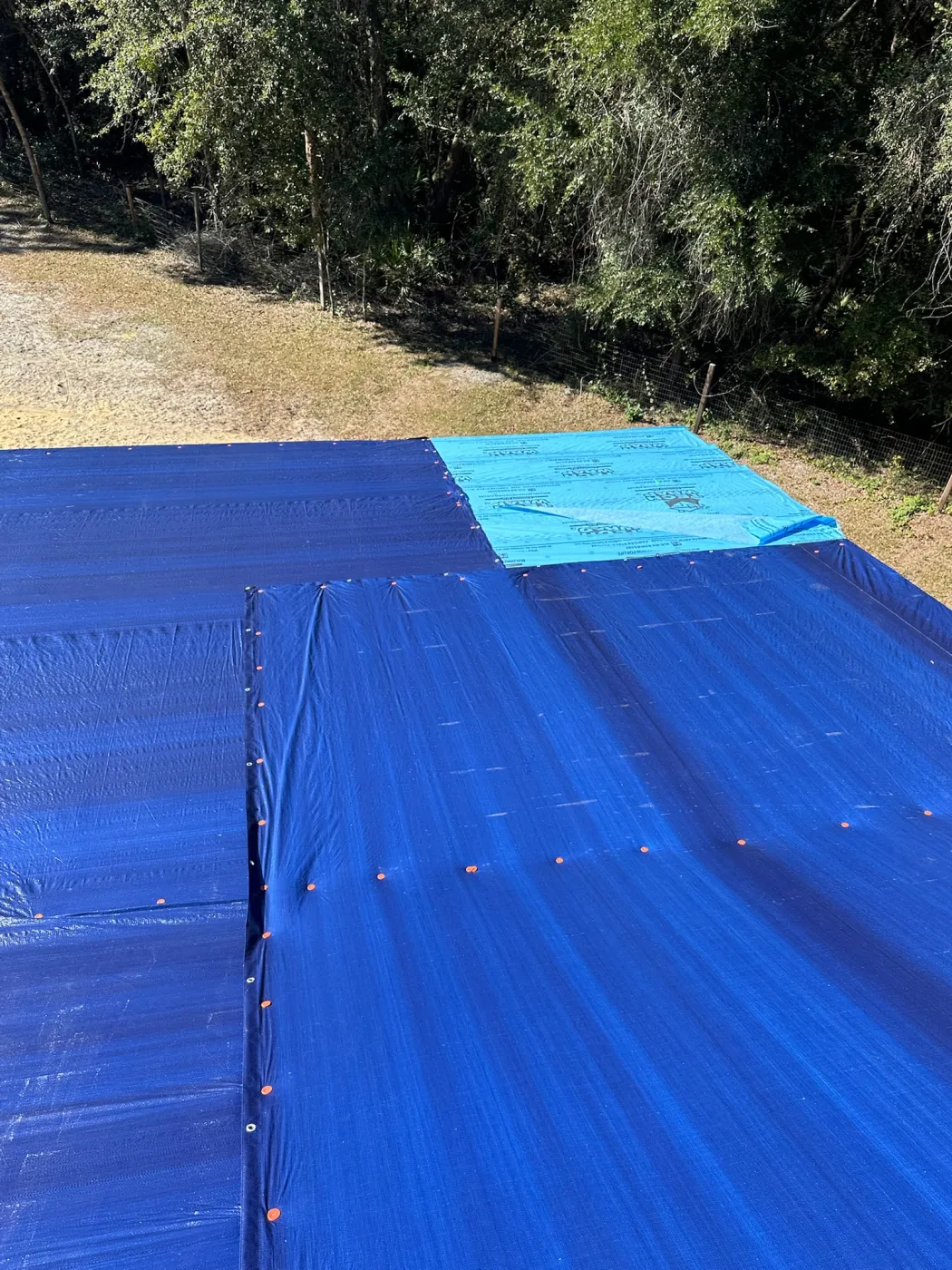 Storm Damage Tarp & Insurance Claim | Sentinel Roofing Alachua, FL Emergency tarp protection for storm-damaged roofing and an insurance claim by Sentinel Roofing in Alachua, FL