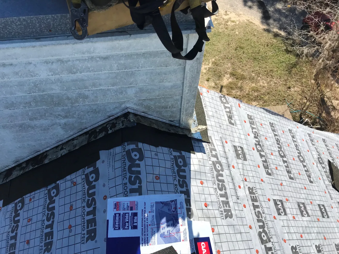 Chimney Flashing & IWS Installation | Sentinel Roofing Alachua, FL GAF FeltBuster roof installation with IWS, chimney flashing, and roofing cement by Sentinel Roofing in Alachua, FL