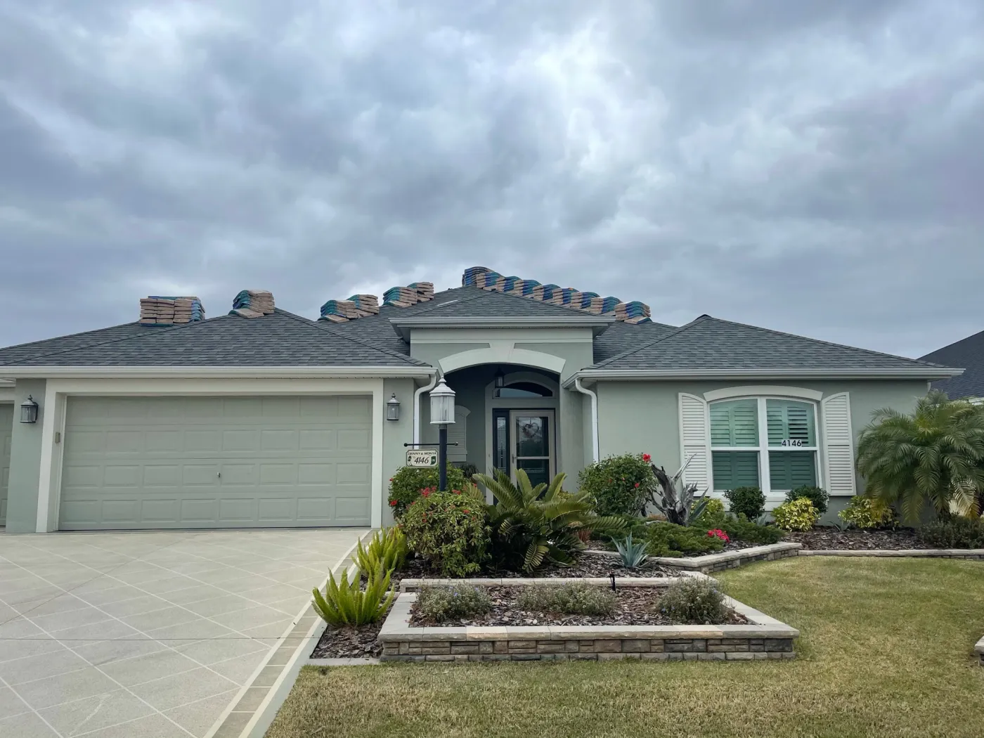 Roof Installation Preparation | Sentinel Roofing Alachua, FL Preloaded shingles prepared for a new roof installation project by Sentinel Roofing in Alachua, FL