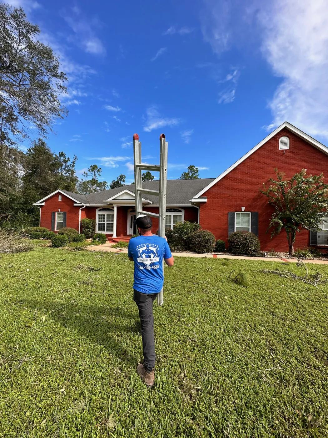 Roof Replacement Inspection & Material Verification | Sentinel Roofing Alachua, FL Sentinel Roofing crew inspecting a roof for replacement needs and verifying roofing materials in Alachua, FL