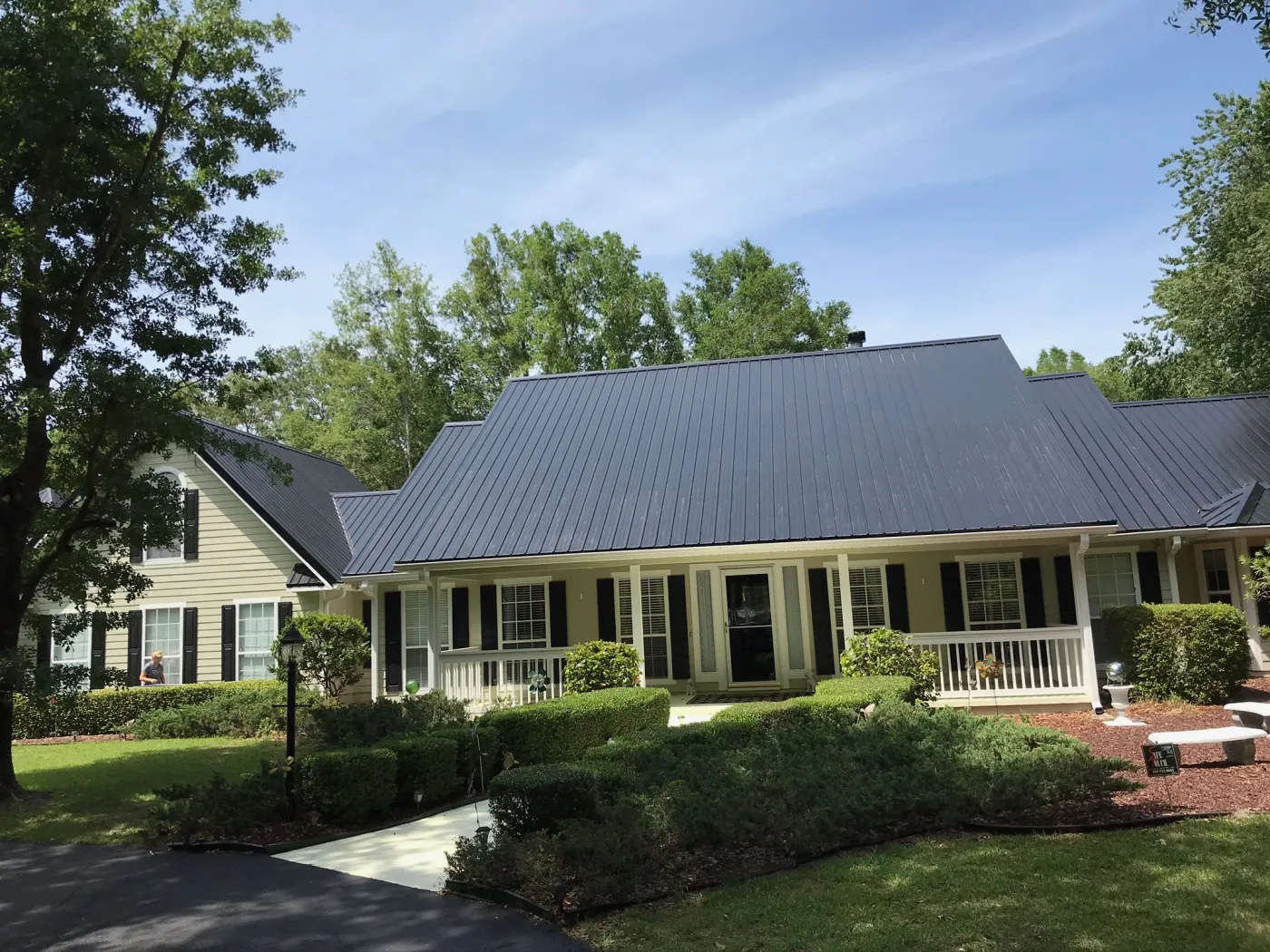 Black Metal Exposed Fastener Roof Installation | Sentinel Roofing Belleview, FL Black metal exposed fastener 26-gauge roof installation with purlins and high-temp underlayment by Sentinel Roofing in Belleview, FL