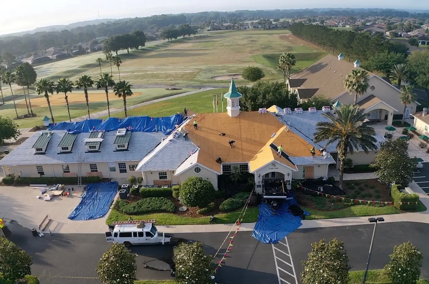 Golf Clubhouse GAF HDZ Roof Replacement | Sentinel Roofing Belleview, FL Golf clubhouse roof replacement with GAF HDZ shingles, metal dormer, and weather protection by Sentinel Roofing in Belleview, FL