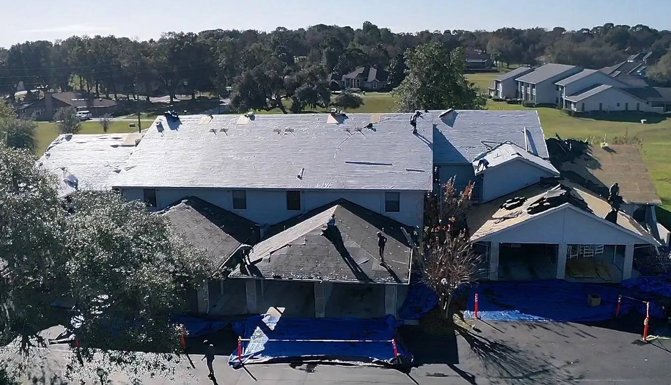 Multifamily Roof Replacement & Quality Check | Sentinel Roofing Belleview, FL Multifamily shingle roof replacement with underlayment, IWS, safety cones, and quality check by Sentinel Roofing in Belleview, FL