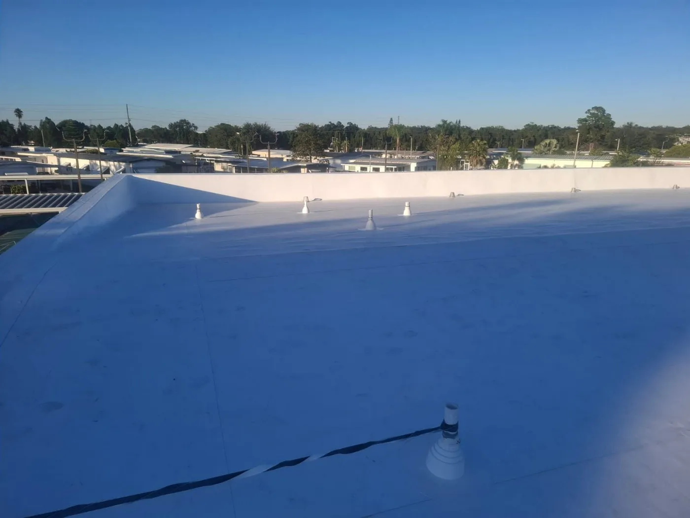 CertainTeed Flat Roof & Tapered ISO System | Sentinel Roofing CertainTeed flat roofing system with tapered ISO insulation installed by Sentinel Roofing certified installers