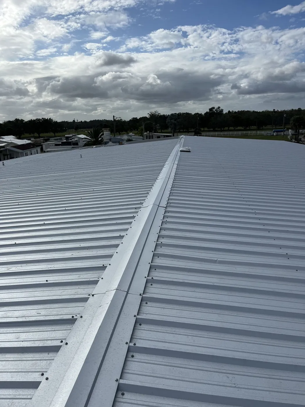 Commercial PBR Panel Metal Roof | Sentinel Roofing Commercial galvanized PBR panel metal roof with TriCounty lifetime screws installed by Sentinel Roofing