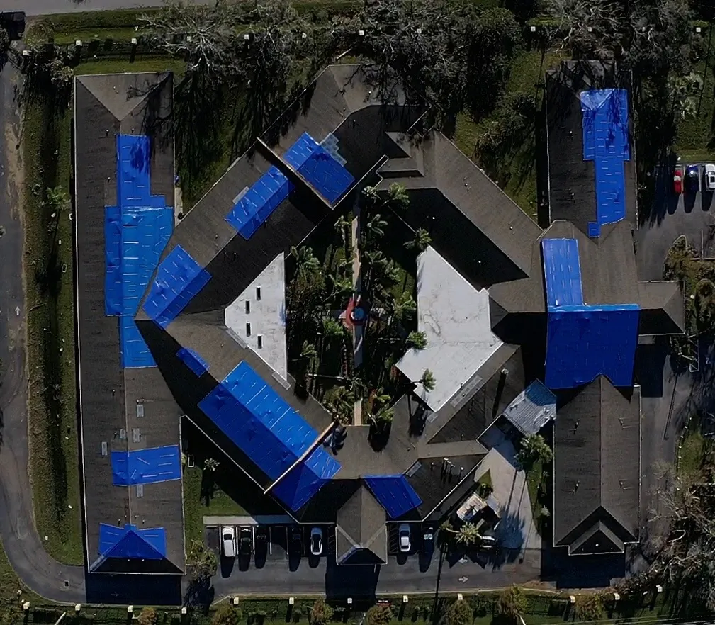 Commercial Hurricane Damage Emergency Tarp | Sentinel Roofing Oxford, FL Emergency tarp protection for hurricane damage and commercial roof leaks by Sentinel Roofing in Oxford, FL