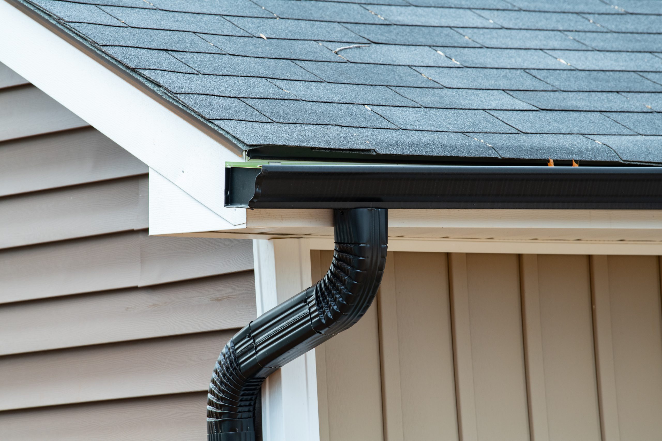 Close-up of black seamless gutters.