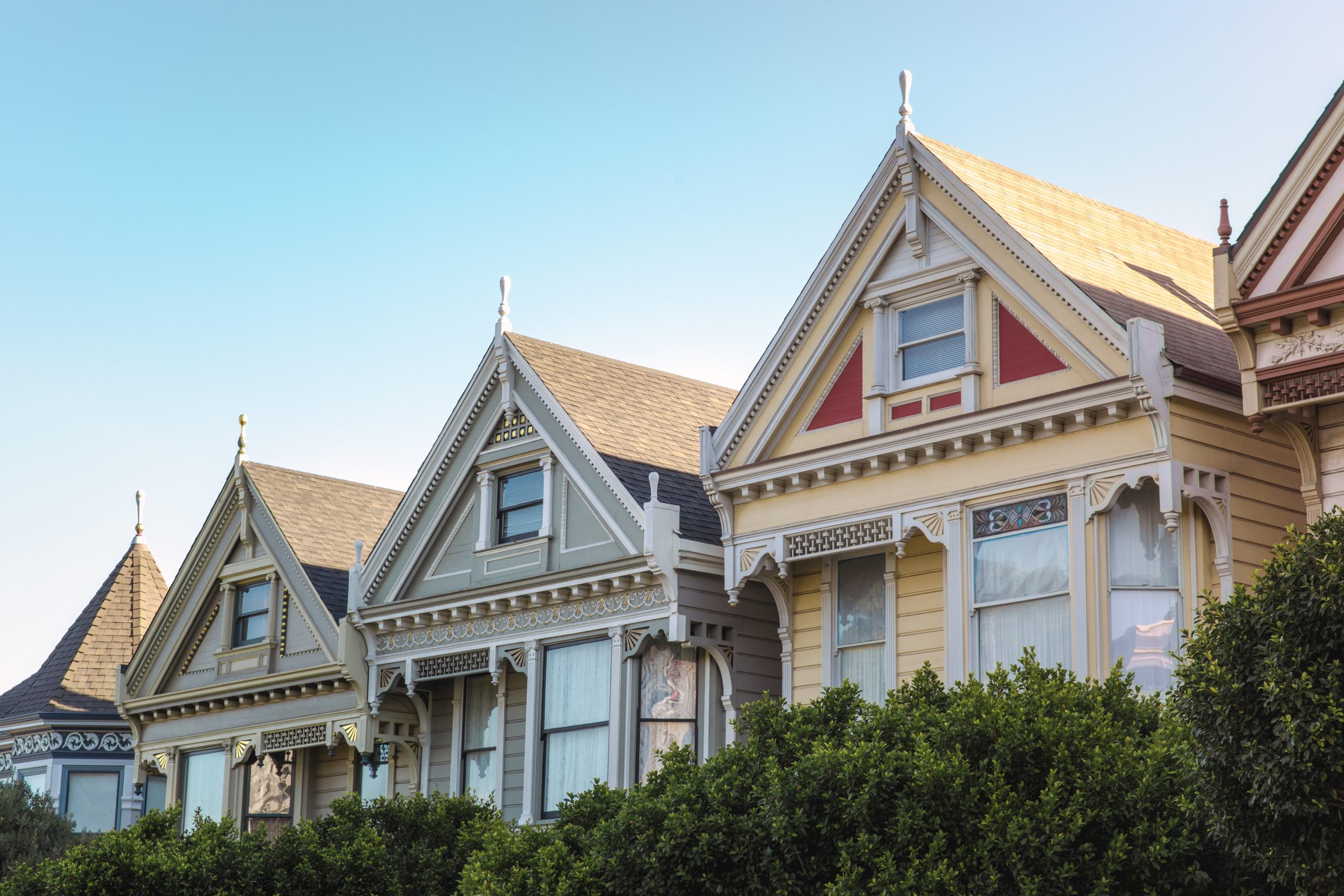 A row of multi-family housing with shingle roofing.