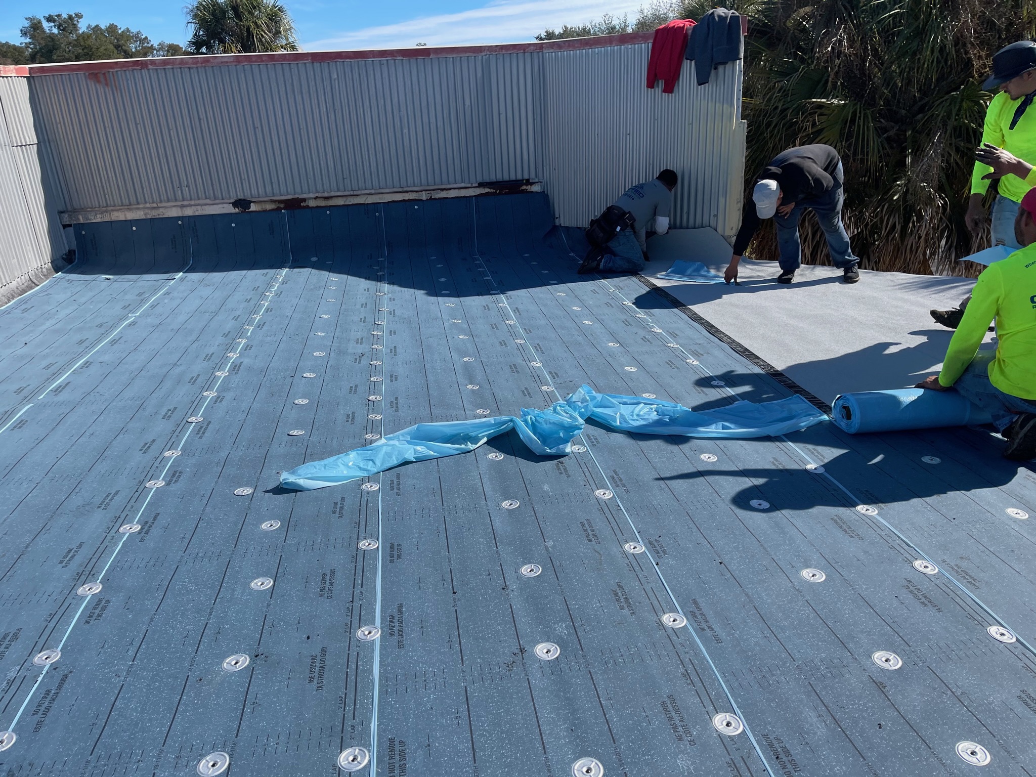 A modified bitumen commercial roof installation.