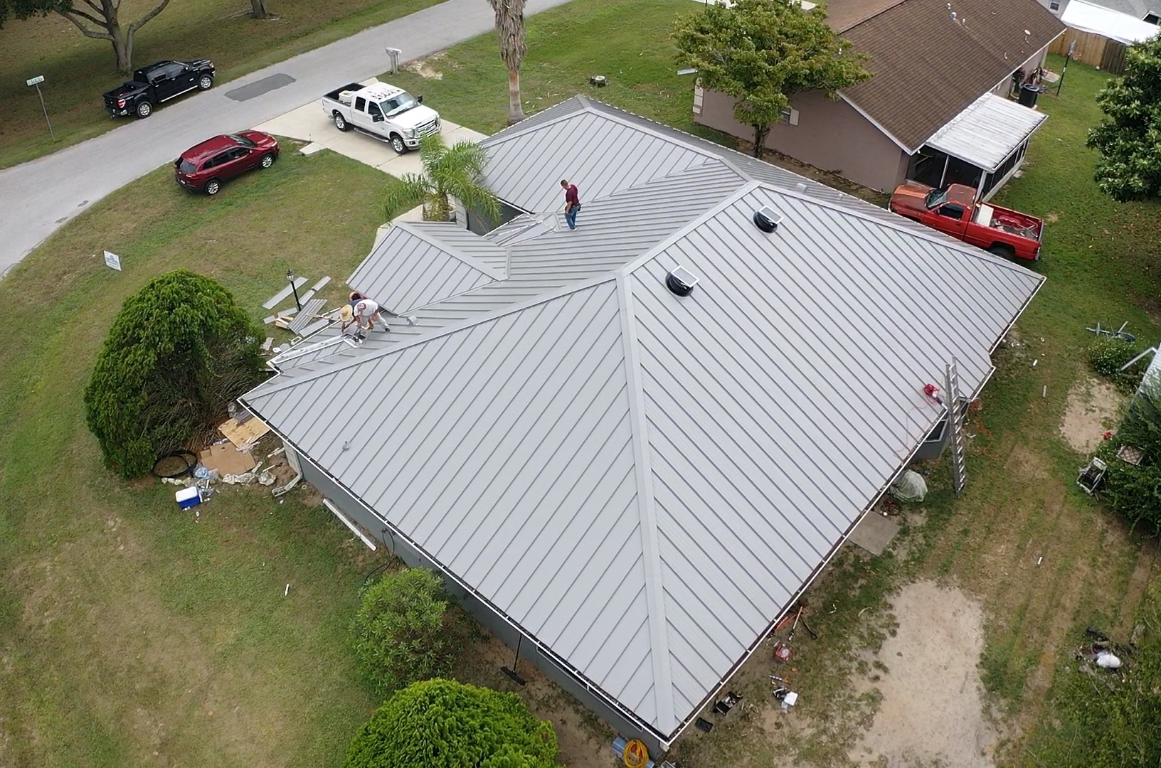 A metal roof replacement in progress by Sentinel Roofing.
