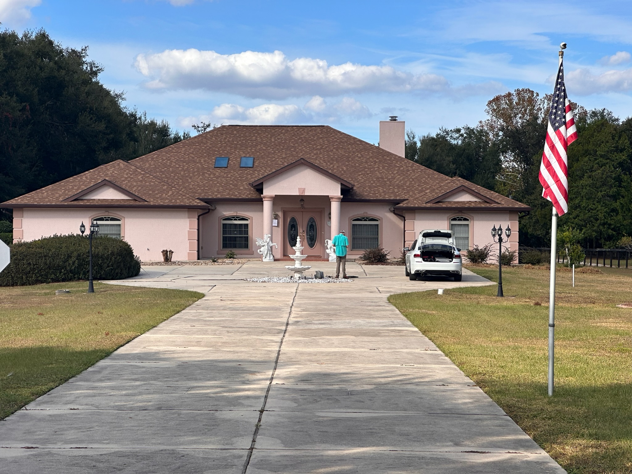 Exterior of a home with a newly installed architectural asphalt shingle roof.