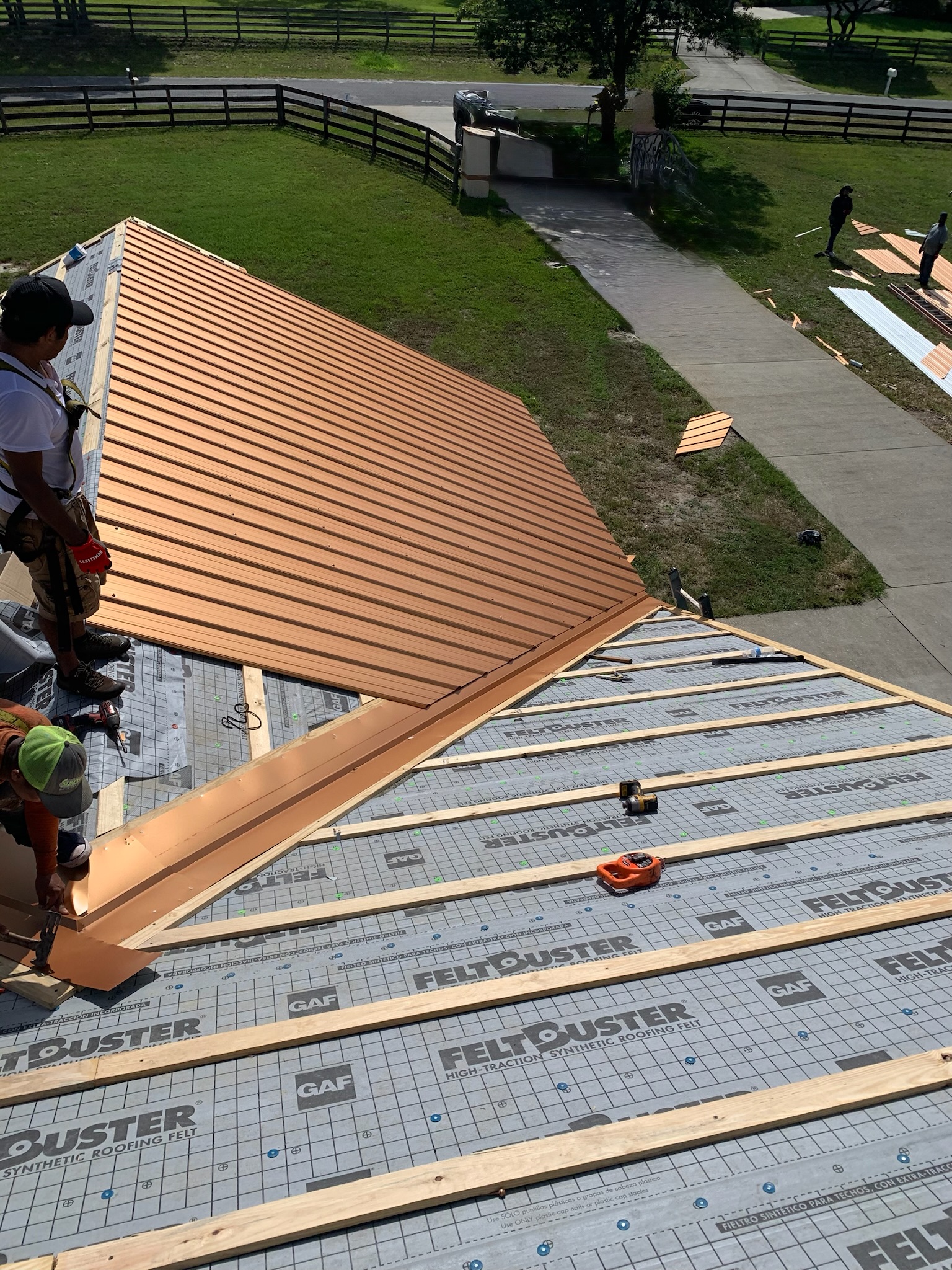 A metal roof replacement by Sentinel Roofing in progress.